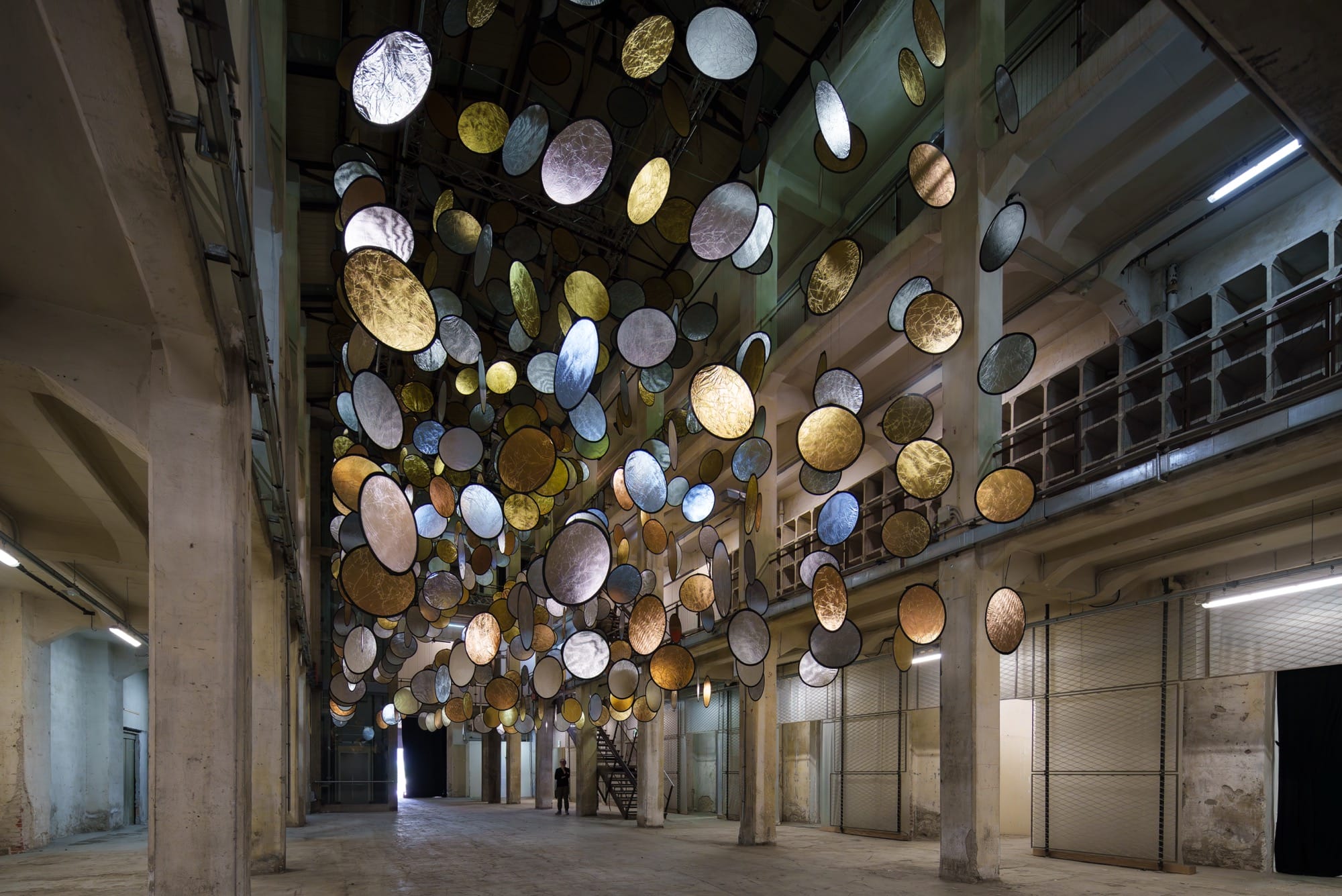 Whispering Lights: Suspended Halos Illuminate a Florentine Workshop